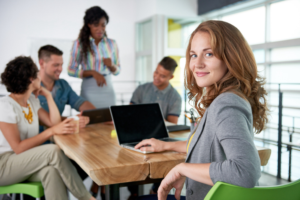 Creative businesswoman leading team in a friendly conversation