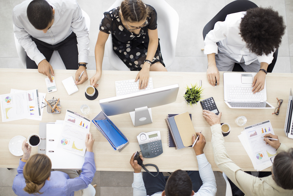 Team of business people working at a table