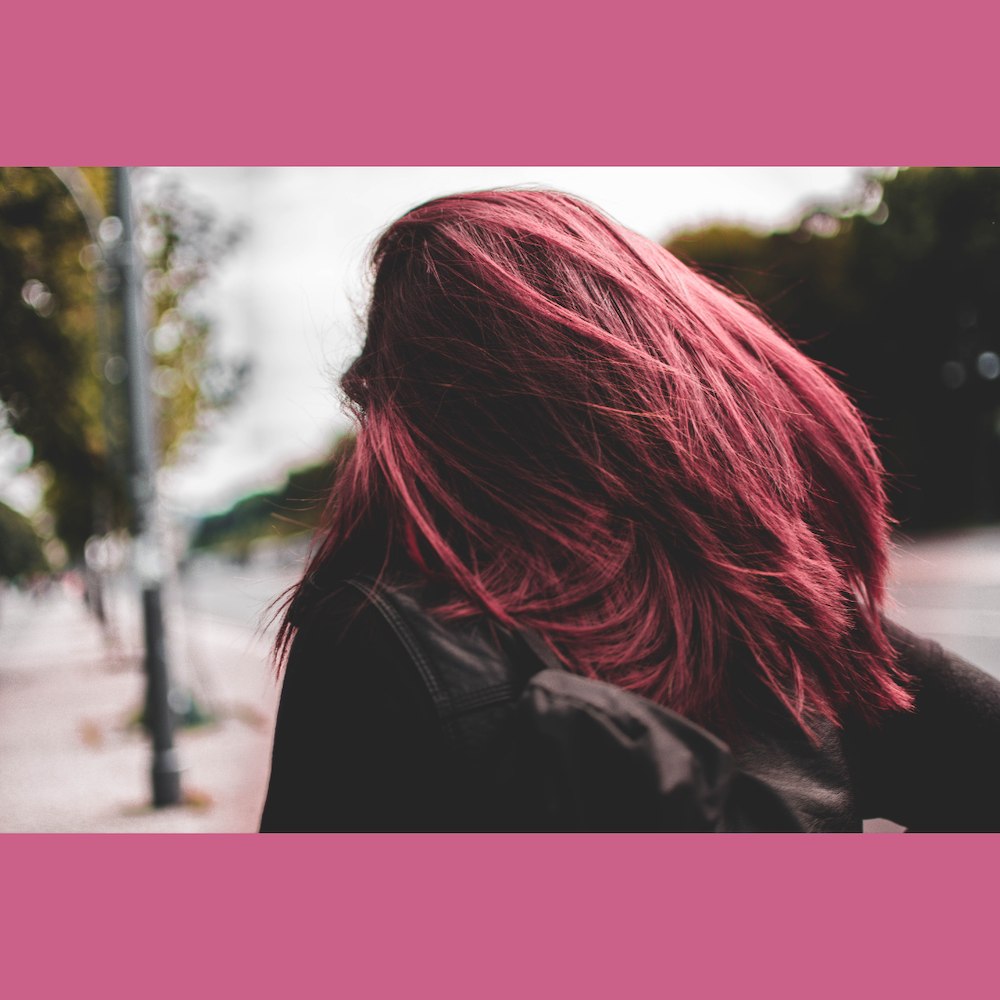 Strong woman with pink hair